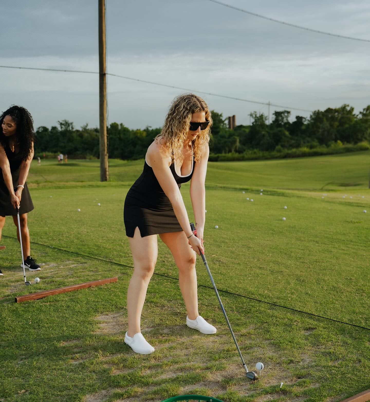 Members practicing their swing at the driving range