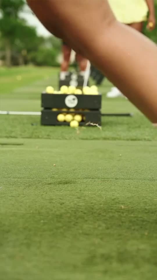 Members walking a fairway together on a play day